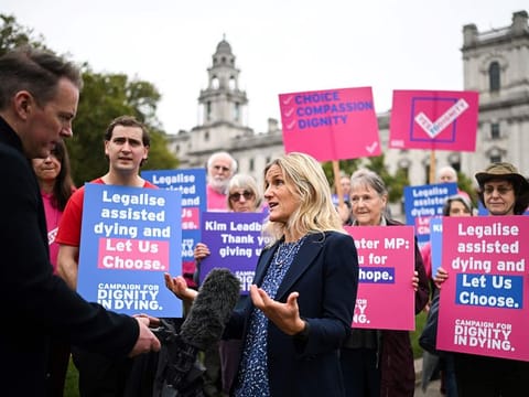 Labour MP Kim Leadbeater speaks to the press during a gathering in favour of the proposal to legalise euthanasia in the UK, called by campaigners from "Dignity in Dying", outside The Palace of Westminster, home to the Houses of Parliament in central London, on October 16, 2024. 
