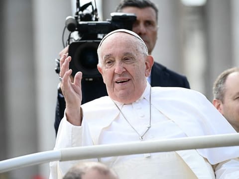 Pope Francis waves from his popemobile after the weekly Angelus prayers, at the Saint Peter's Square in the Vatican on October 20, 2024.  