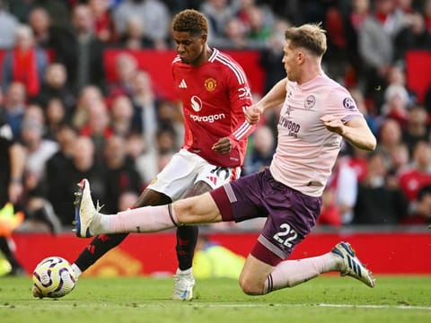 Manchester United's English striker Marcus Rashford (left) is clocked by Brentford's Irish defender Nathan Collins during the English Premier League football match at Old Trafford in Manchester, north west England, on October 19.