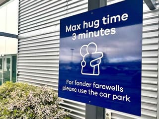 New Zealand airport sets three-minute limit on hugs