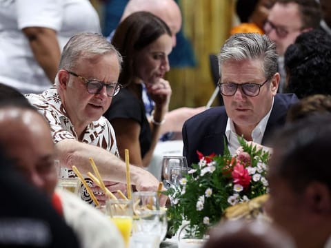 Australia's Prime Minister Anthony Albanese (L) and British Prime Minister Keir Starmer attend a State Banquet during the Commonwealth Heads of Government Meeting (CHOGM) in Apia, Samoa, on October 24, 2024. 