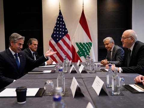 United States Secretary of State Antony Blinken (L) meets with Lebanon's Prime Minister Najib Mikati (R) in London, on October 25, 2024. 