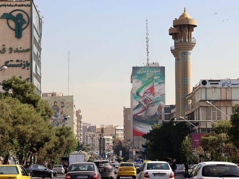 Commuters drive along a street in Tehran on October 26, 2024. Residents of Tehran awoke and went about their business as planned on October 26 after their sleep was troubled by Israeli strikes that triggered blasts that echoed across the city.