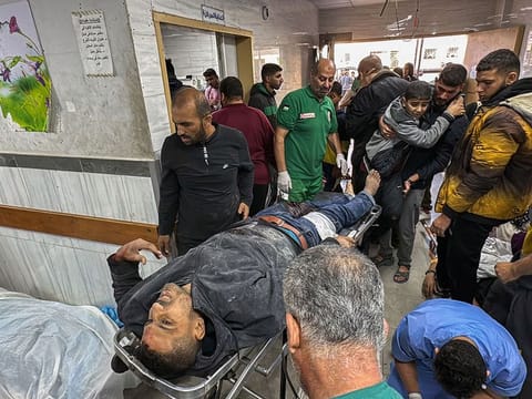Graphic content: Palestinians injured in Israeli bombardment of the Beit Lahia Project are transported into the Kamal Adwan Hospital in Beit Lahia in the northern Gaza Strip on October 23, 2024 amid the ongoing war between Israel and the Palestinian Hamas group. 