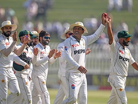 Pakistan's Sajid Khan (R) and Noman Ali (2R) celebrate along with teammates as they walk off the field after the end of England's second innings during the third day of the third and final Test cricket match between Pakistan and England at the Rawalpindi Cricket Stadium in Rawalpindi on October 26, 2024. 