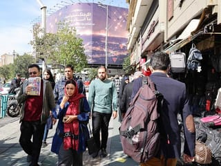 People walk along a street in Tehran. File photo
