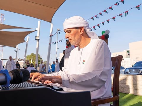 Khaled Moustafa playing a piano during an event at Amana Healthcare hospital in Abu Dhabi recently