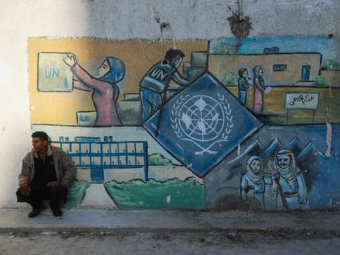 A wall bearing a mural representing the UNRWA (United Nations Relief and Works Agency) at the aid agency's centre at the Nuseirat camp for Palestinian refugees in the central Gaza Strip on October 29, 2024.  