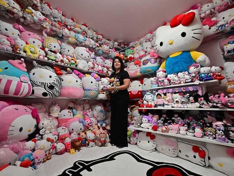 Helen, founder of the 'Hello Kitty SoCal Babes' fan club, poses with her collection inside her "she-shed" in Riverside County, California. 