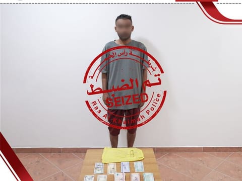  Ras Al Khaimah Police arrest a masked thief responsible for a series of vehicle break-ins across the emirate, and recovered stolen items from him.