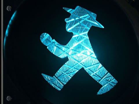 The little man with hat in the traffic light has transformed into an improbable symbol of reunified Germany.
