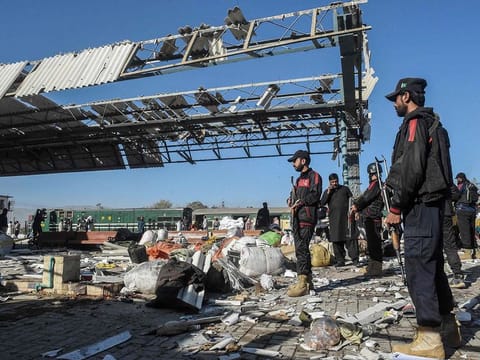 Security personnel inspect the blast area after an explosion at a railway station in Quetta, in Pakistan's Balochistan province on November 9, 2024.   