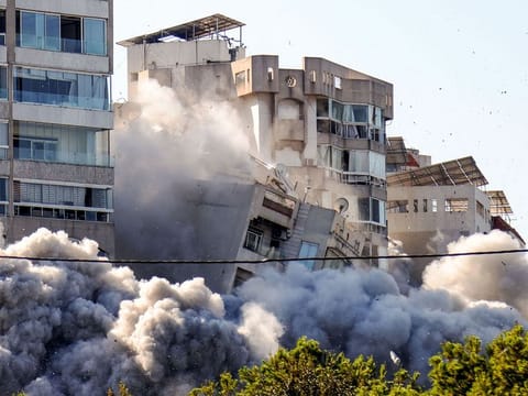 This picture shows the moment a building collapses after an Israeli airstrike on Beirut's southern Ghobeiry neighbourhood on November 15, 2024, amid the ongoing war between Israel and Hezbollah