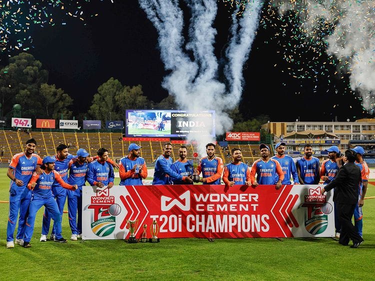 India players hold the trophy as they celebrate
