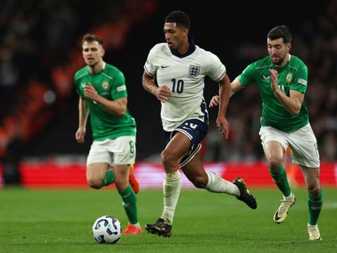 England's midfielder Jude Bellingham runs with the ball from Ireland's midfielder Finn Azaz during the Uefa Nations League, League B - Group 2, football match at Wembley Stadium in London on Sunday.