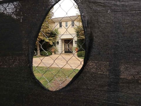 Outside the mansion where brothers Lyle and Erik Menendez murdered their parents in 1989 in Beverly Hills, California. 
