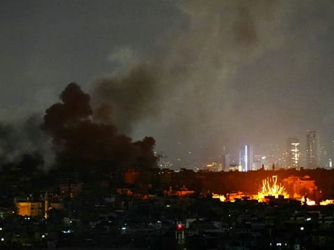 Smoke rises and a fireball errupts from the site of Israeli airstrikes that targeted Beiruts southern suburbs on November 24, 2024, amid the ongoing war between Israel and Hezbollah. Lebanon's state media reported a slew of Israeli air strikes on Beirut's southern suburbs on November 24, after the Israeli military posted evacuation calls online for parts of the Hezbollah bastion. (Photo by AFP)
