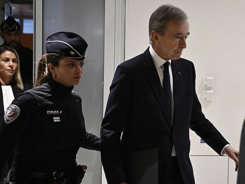 LVMH CEO Bernard Arnault (R) leaves Paris court after testifying in influence-peddling trial against former French intelligence head of internal security Bernard Squarcini, in Paris on November 28, 2024.   