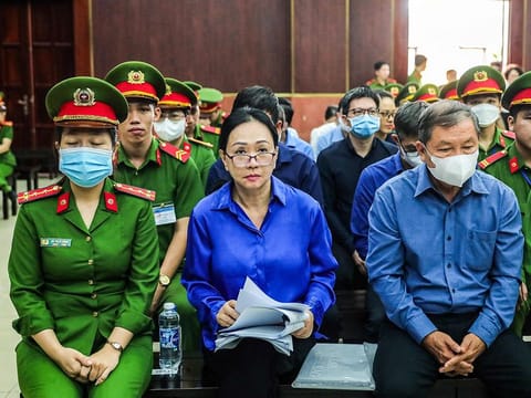 This picture taken on November 25, 2024 shows Vietnamese property tycoon Truong My Lan (centre) looking on at a court in Ho Chi Minh City. 
