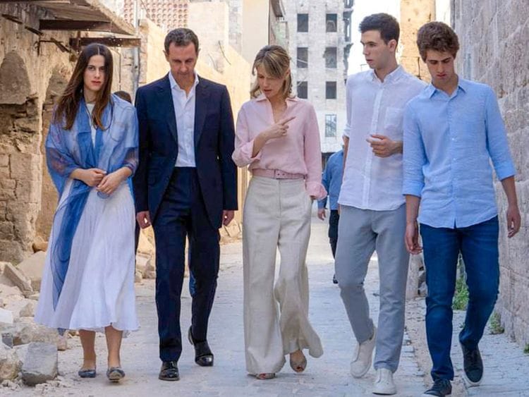 Al Assad and his wife Asma (centre) walking with their children, Hafez (second right), Karim and Zein next to the Grand Umayyad mosque in the northern Syrian city of Aleppo on July 8, 2022.  