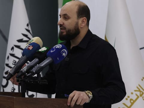 Mohammed Al Bashir, who heads HTS's so-called Syrian Salvation Government, holds a press conference in the rebel-held northwestern Syrian city of Idlib on November 28, 2024.  