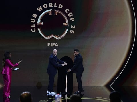 Fifa President Gianni Infantino and Ronaldo present The Fifa Club World Cup Trophy during the 2025 Fifa Club World Cup Draw at Telemundo Studios on December 05 in Miami, Florida.   