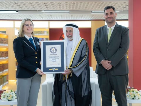 His Highness Dr Sheikh Sultan bin Mohammed Al Qasimi, Supreme Council Member and Ruler of Sharjah, and Supreme President of the Arabic Language Academy in Sharjah, receiving the Guinness World Records certificate on Wednesday 