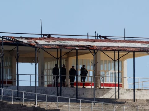 Israeli soldiers stand in a building inside the buffer zone that separates the Israeli-annexed Golan Heights from the rest of Syria on December 18, 2024.  
