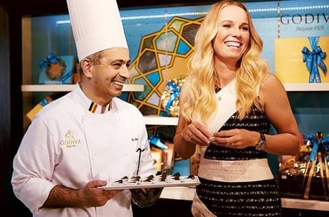 With tennis star Caroline Wozniacki, Godiva’s brand ambassador. 