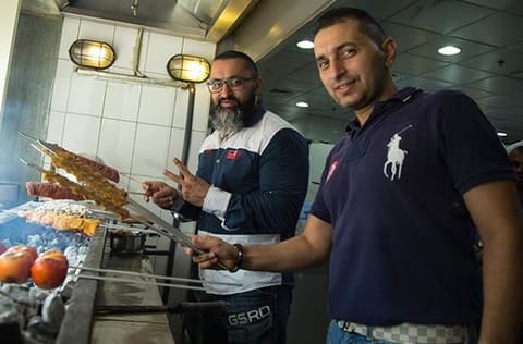 Abbas and Talib Ansari, the sons of the late founder of Al Ustadi Special Kabab, man the grill. 