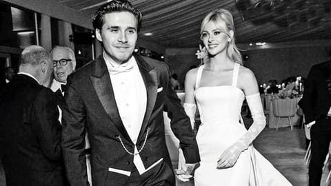 While Nicola wore a Valentino gown, Brooklyn a bespoke suit by Kim Jones of Dior 