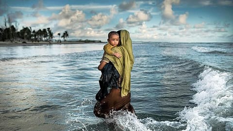 Asad’s photograph of a refugee woman walking towards the shore with her toddler was the first from a Bangladeshi photographer to be featured on the National Geographic cover 