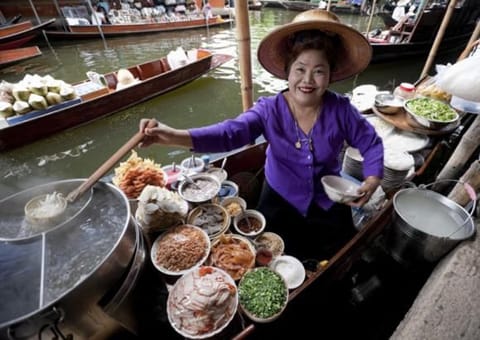 It’s a food-lover’s paradise – eat at one of Bangkok’s floating markets. 