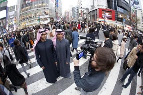 In Japan: Mohamed, left, and brother Payman filming Planet Peeta. 